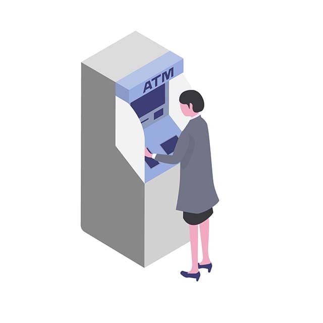 ATMで操作している女性